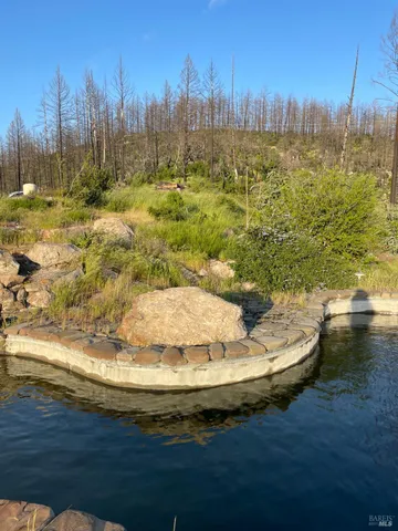 a view of outdoor space with deck and yard