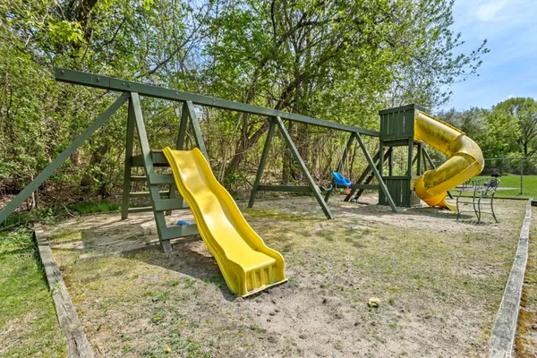 a view of a park with a slide