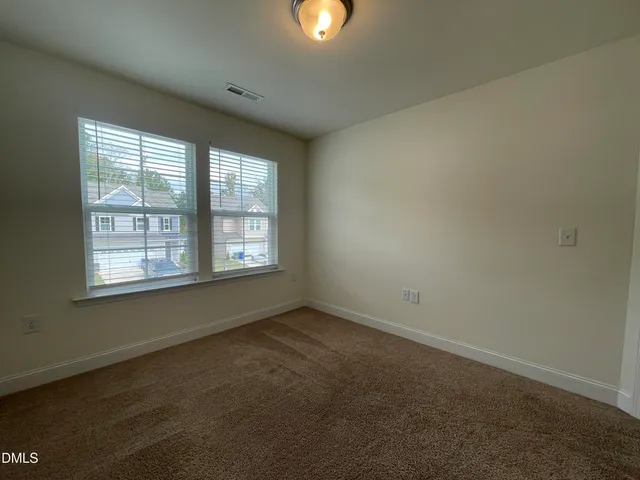 an empty room with closet area