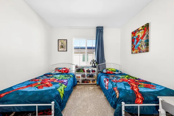 a bedroom with a bed and cabinets