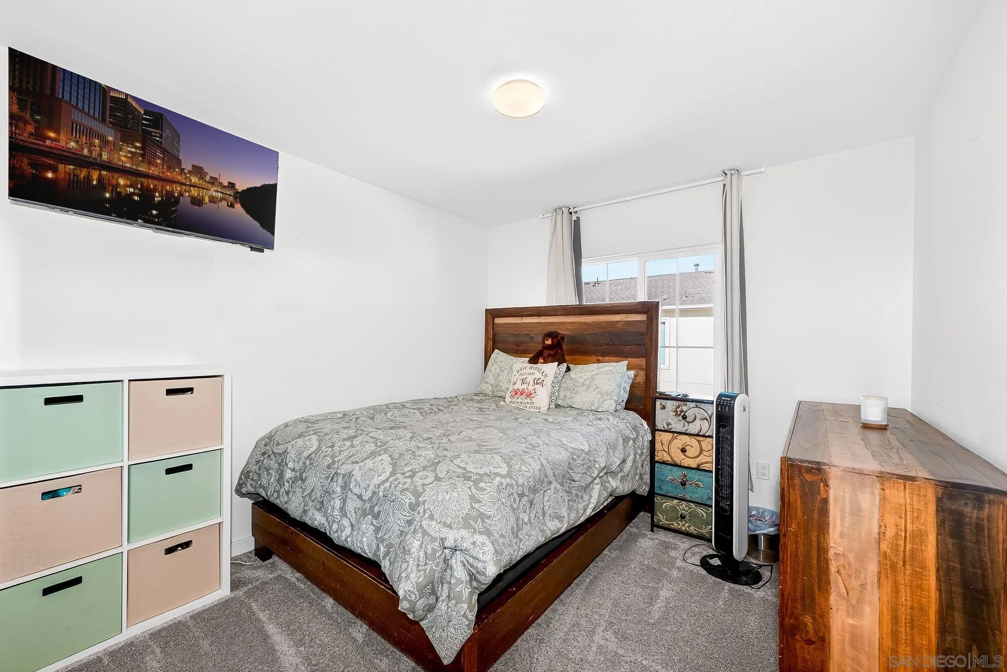 307 Seedling Way Fallbrook, CA 92028 - Photo 12 of 20 a bedroom with a bed and cabinets