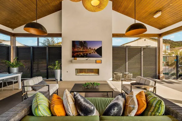 a kitchen with furniture and large windows