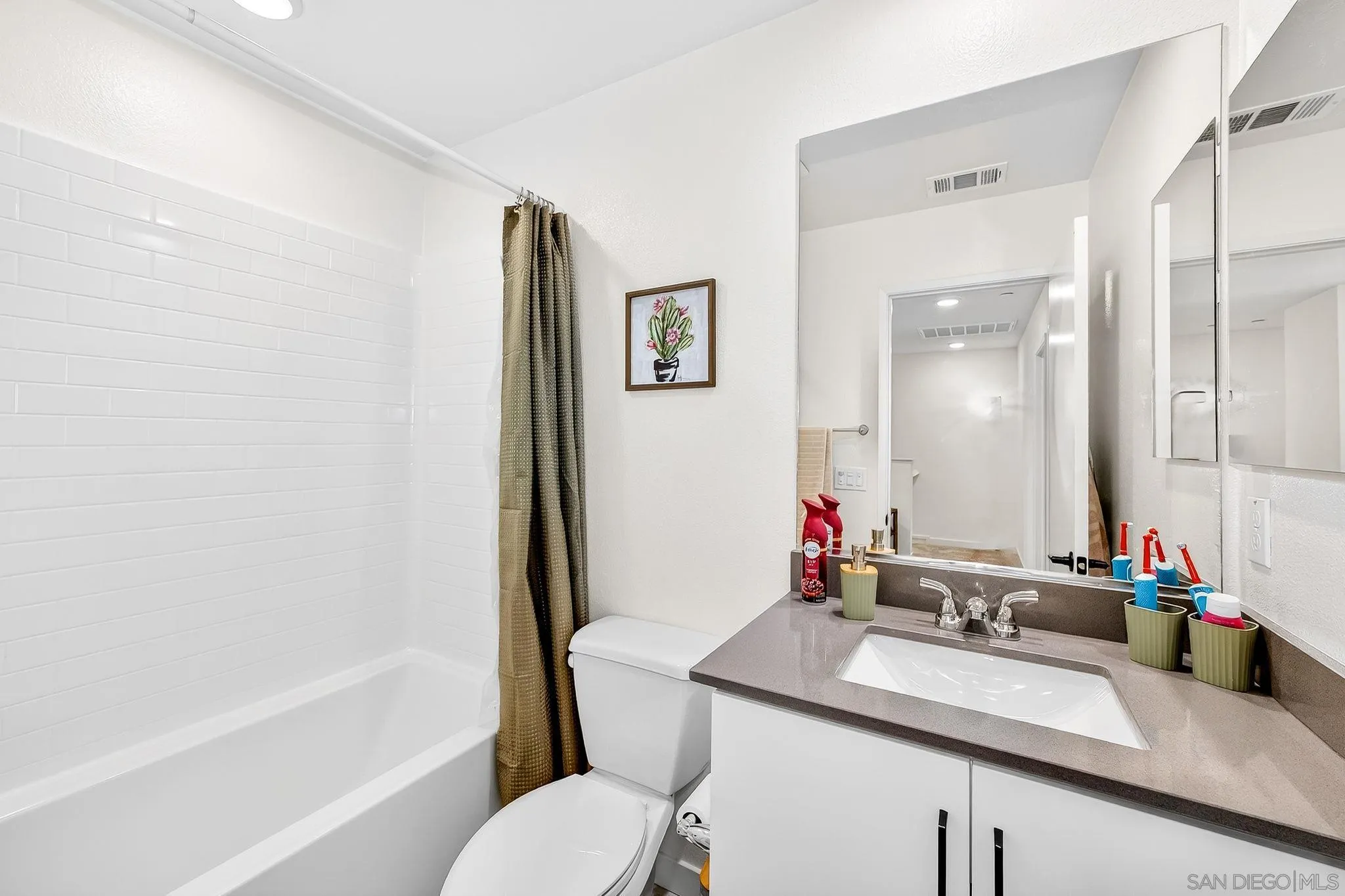 307 Seedling Way Fallbrook, CA 92028 - Photo 10 of 20 a bathroom with a granite countertop sink mirror toilet and bathtub
