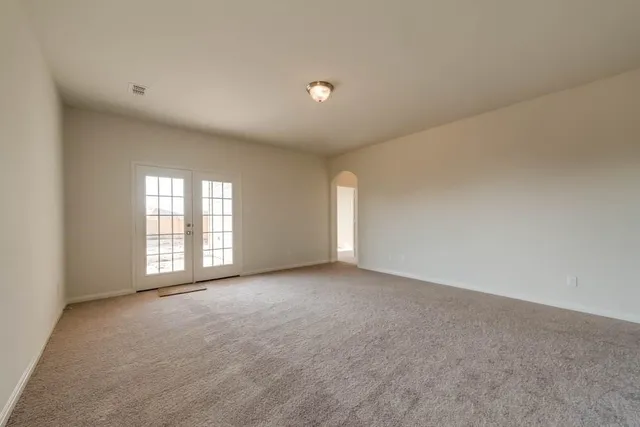 a view of an empty room with a window