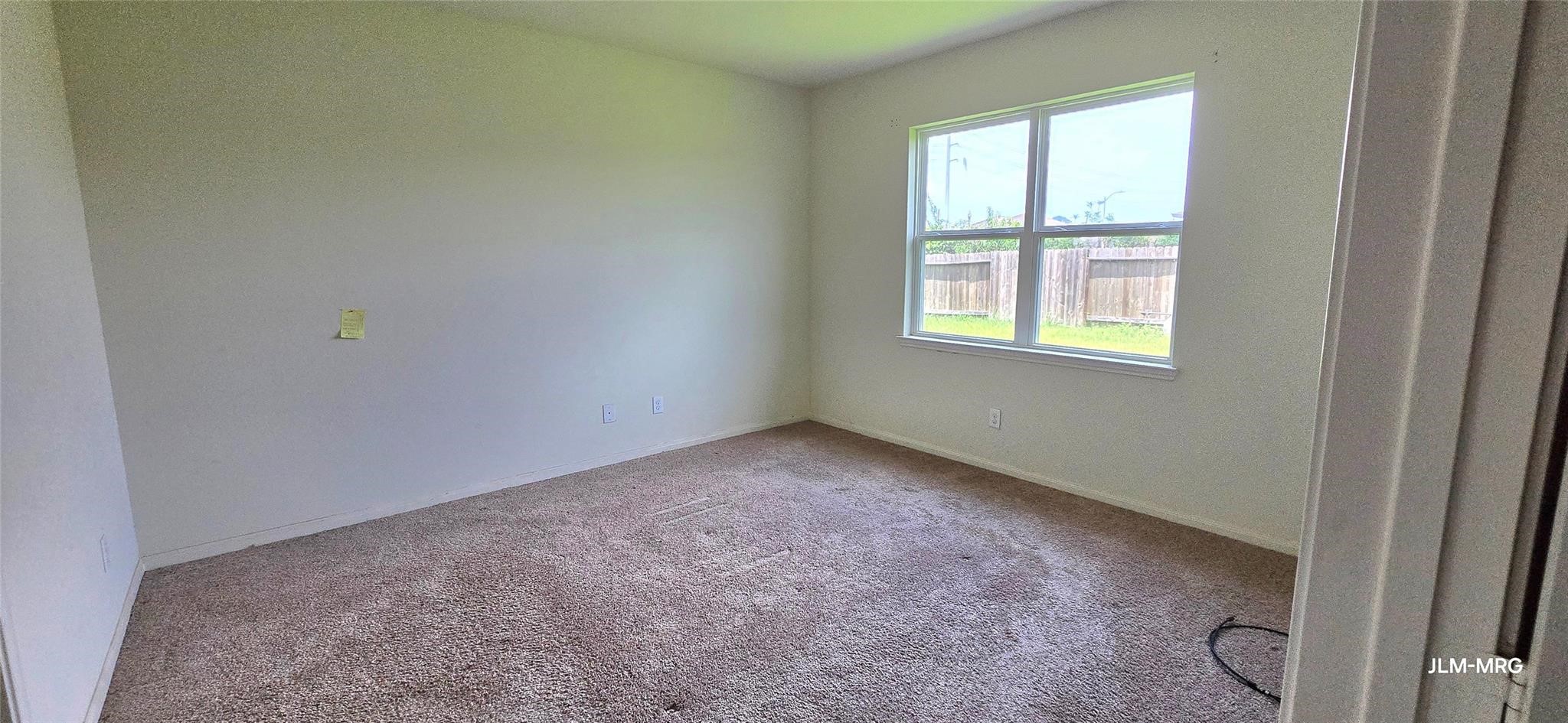 4903 Jagged Cliff Lane Rosenberg, TX 77469 - Photo 3 of 6 an empty room with a window