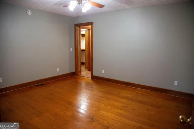 an empty room with a empty space and a window