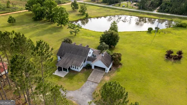 a view of a house with a sink and backyard
