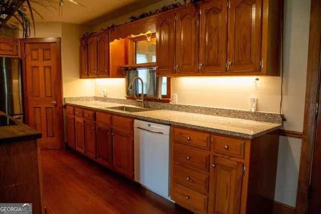 a kitchen with a sink and cabinets