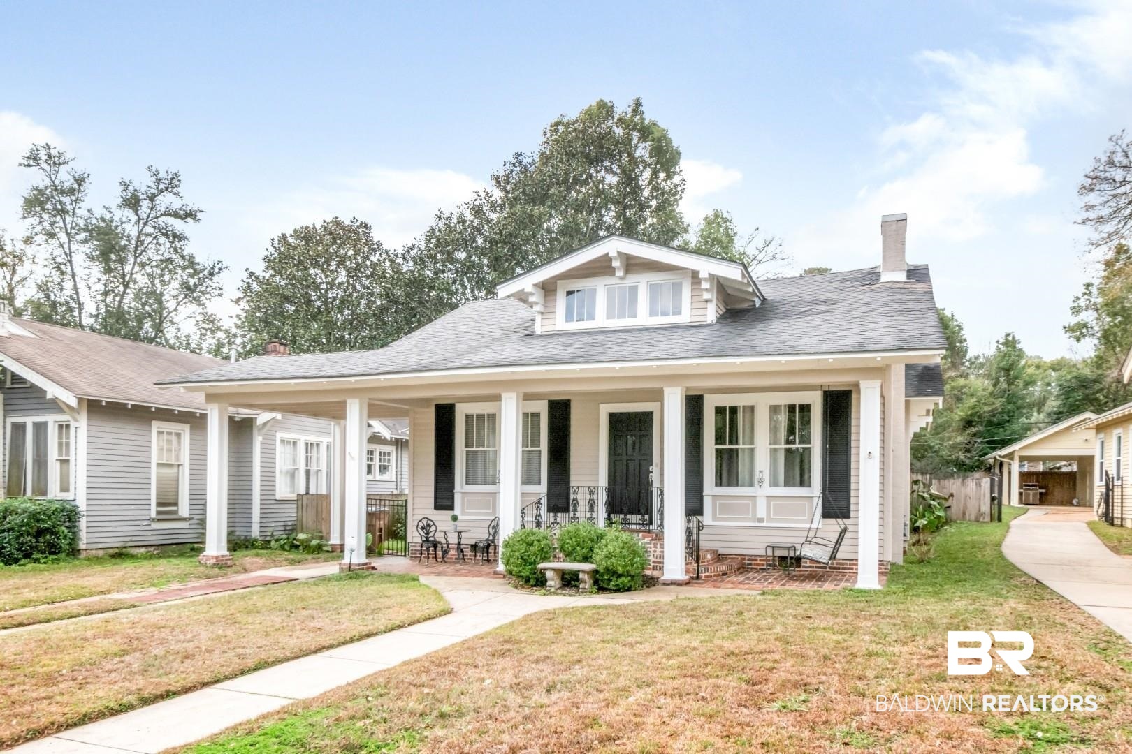 135 Silverwood Street Mobile, AL 36607 - Photo 32 of 32 Bungalow-style home with covered porch, a chimney, and a shingled roof