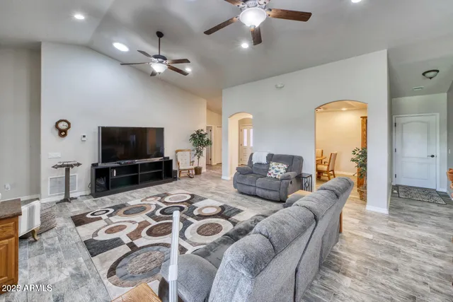 a living room with furniture and a table