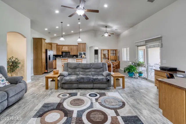 a kitchen with granite countertop a sink a counter top space appliances and cabinets