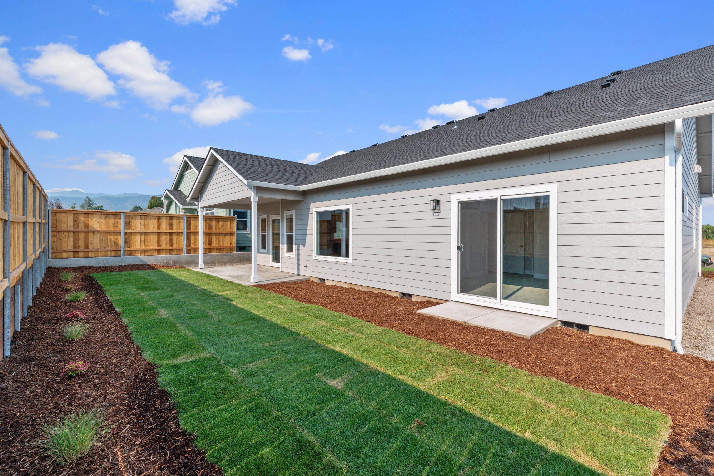 220 Autumn Ridge Road Talent, OR 97540 - Photo 26 of 27 Landscaped backyard with high privacy fence.