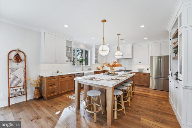 a white bath tub sitting next to a bathroom sink