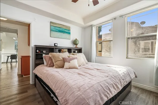 a bedroom with a large bed and a window