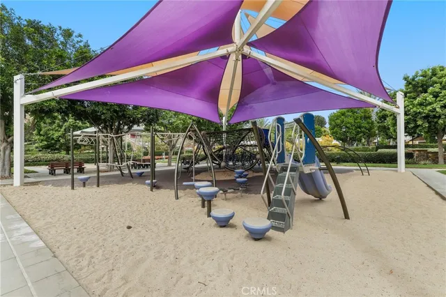 a view of a house with backyard porch and sitting area