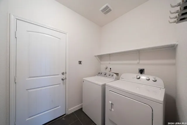 a utility room with dryer and washer