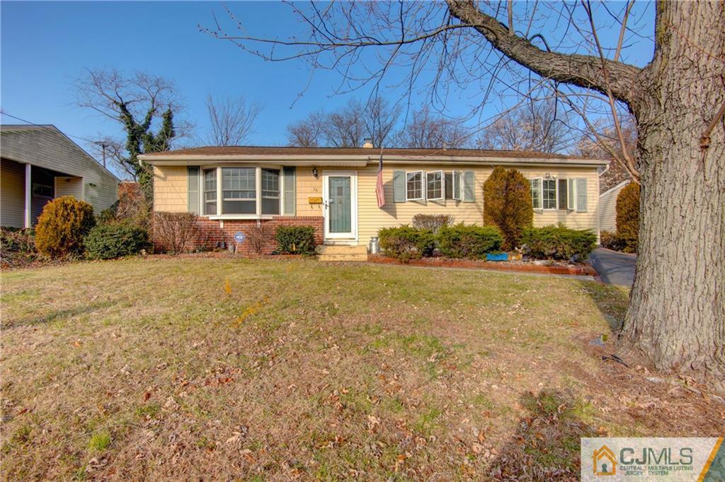 38 Tunison Road New Brunswick, NJ 08901 - Photo 1 of 18 a front view of a house with a yard