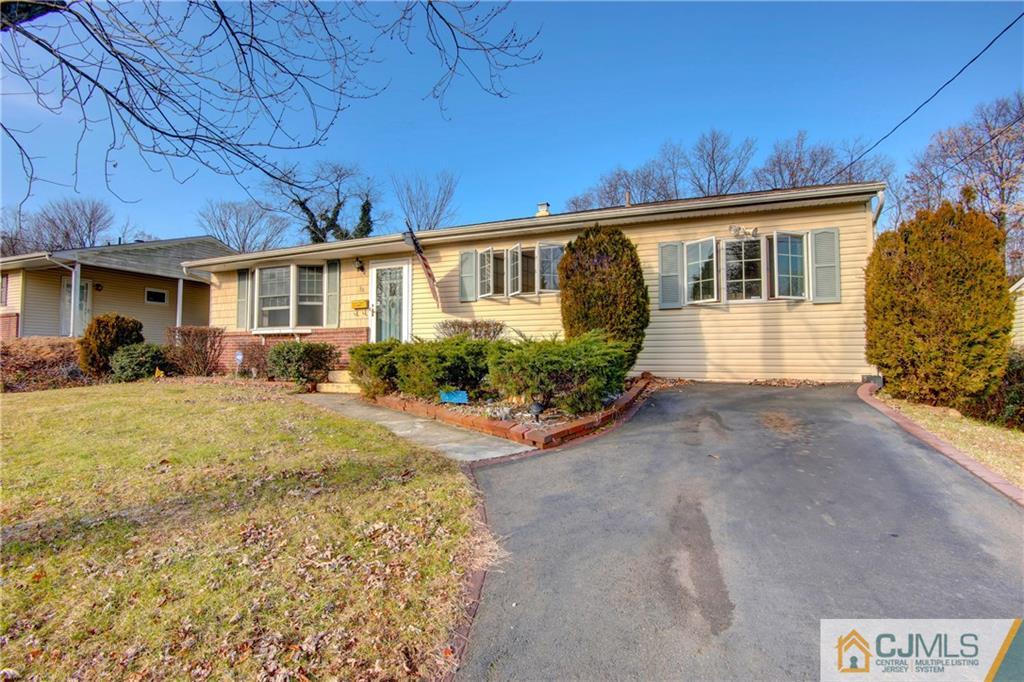38 Tunison Road New Brunswick, NJ 08901 - Photo 2 of 18 a front view of a house with garden