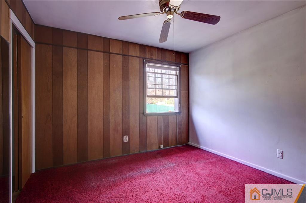 38 Tunison Road New Brunswick, NJ 08901 - Photo 11 of 18 an empty room with a window and a fan