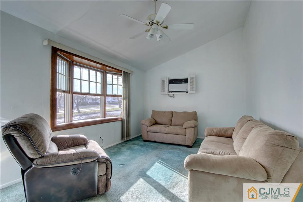 38 Tunison Road New Brunswick, NJ 08901 - Photo 3 of 18 a living room with furniture and a window