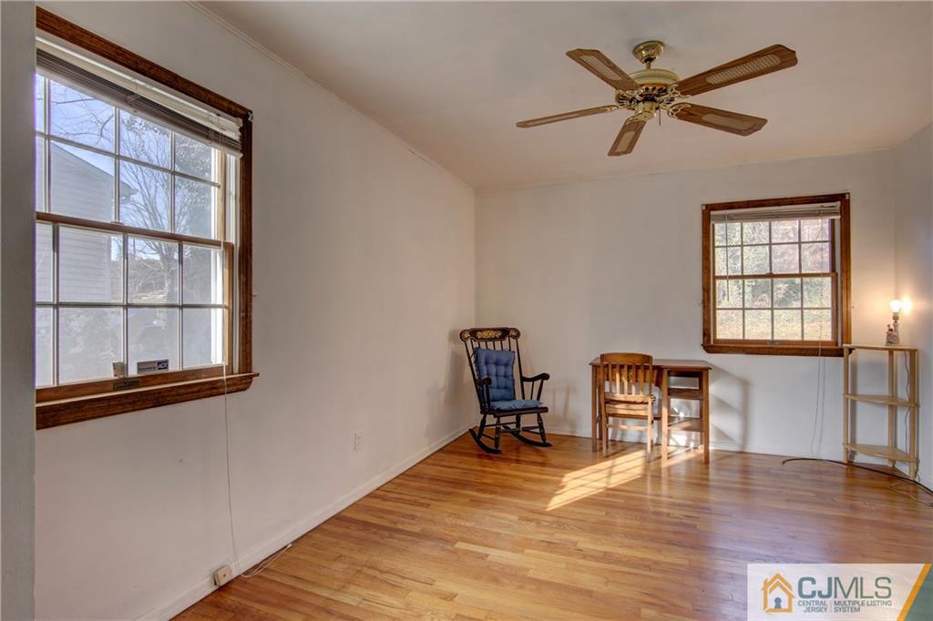 38 Tunison Road New Brunswick, NJ 08901 - Photo 9 of 18 a view of a livingroom with wooden floor and a window