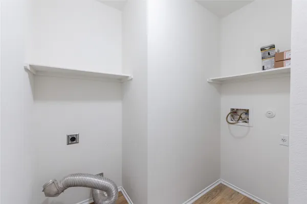 a white bath tub sitting next to a shower