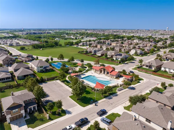 an aerial view of a house with a ocean view