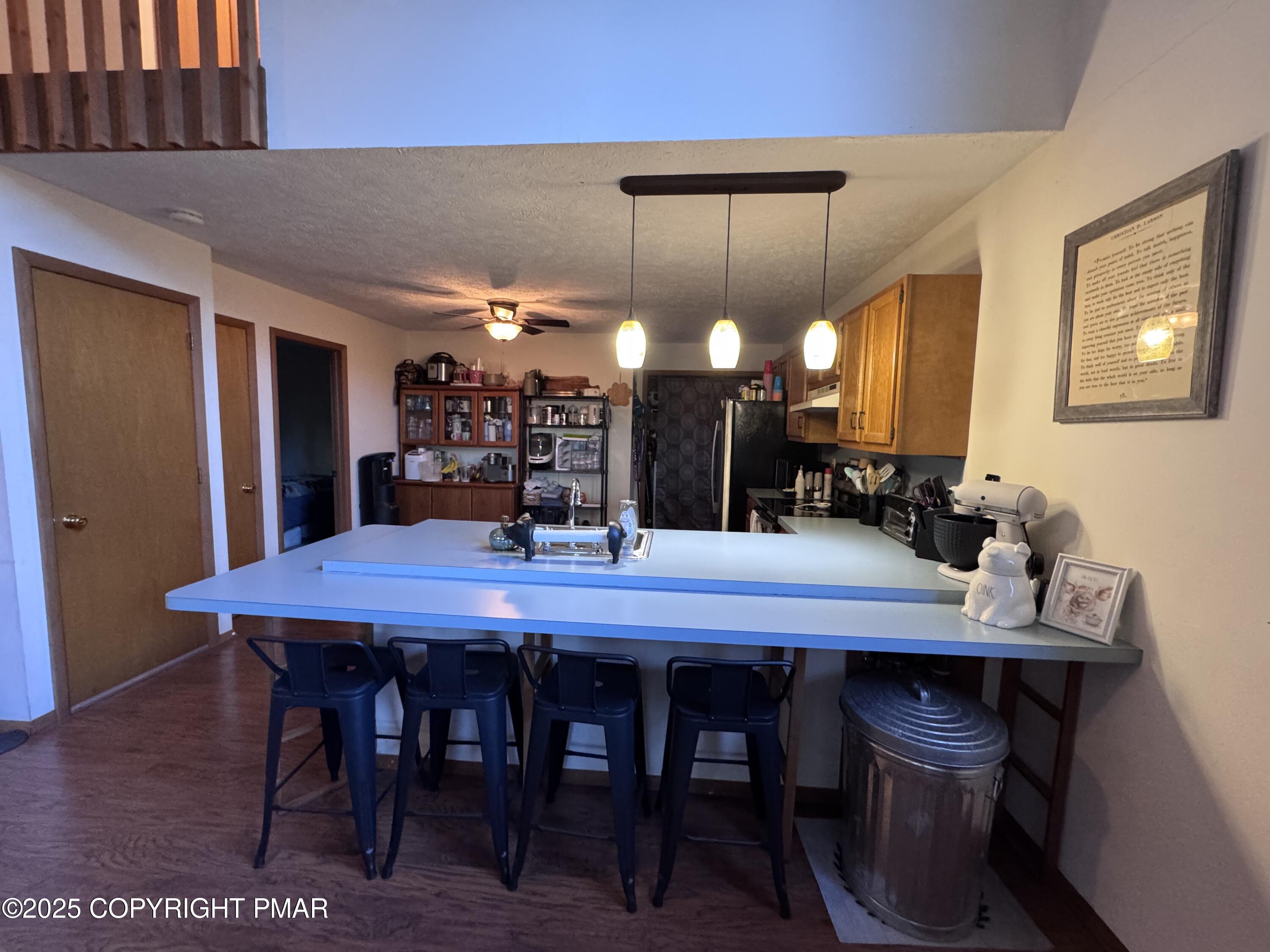67 Seneca Road Albrightsville, PA 18210 - Photo 20 of 52 a dining area with a table chairs and a wooden floor
