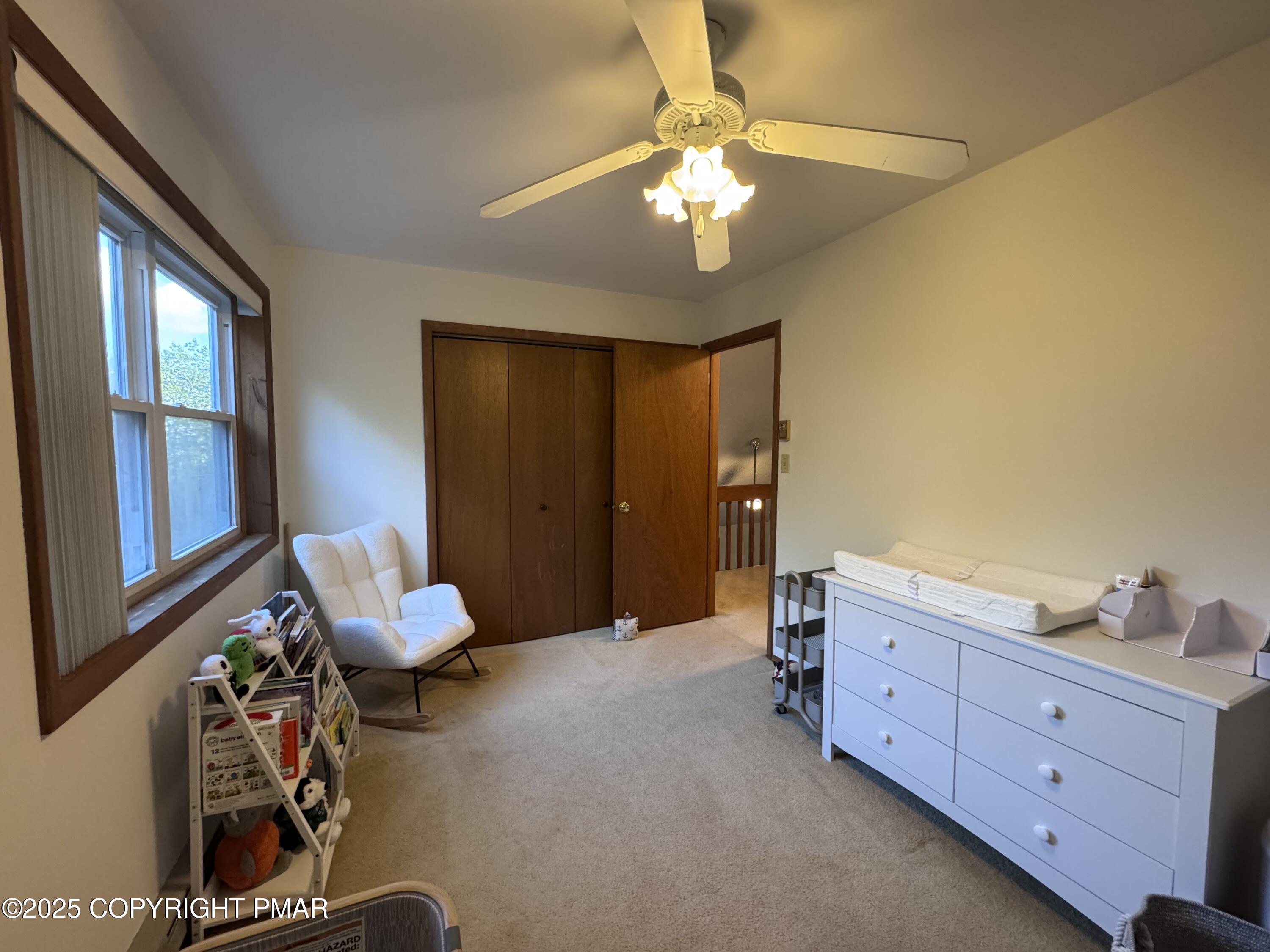 67 Seneca Road Albrightsville, PA 18210 - Photo 26 of 52 a bed room with a bed and a chandelier