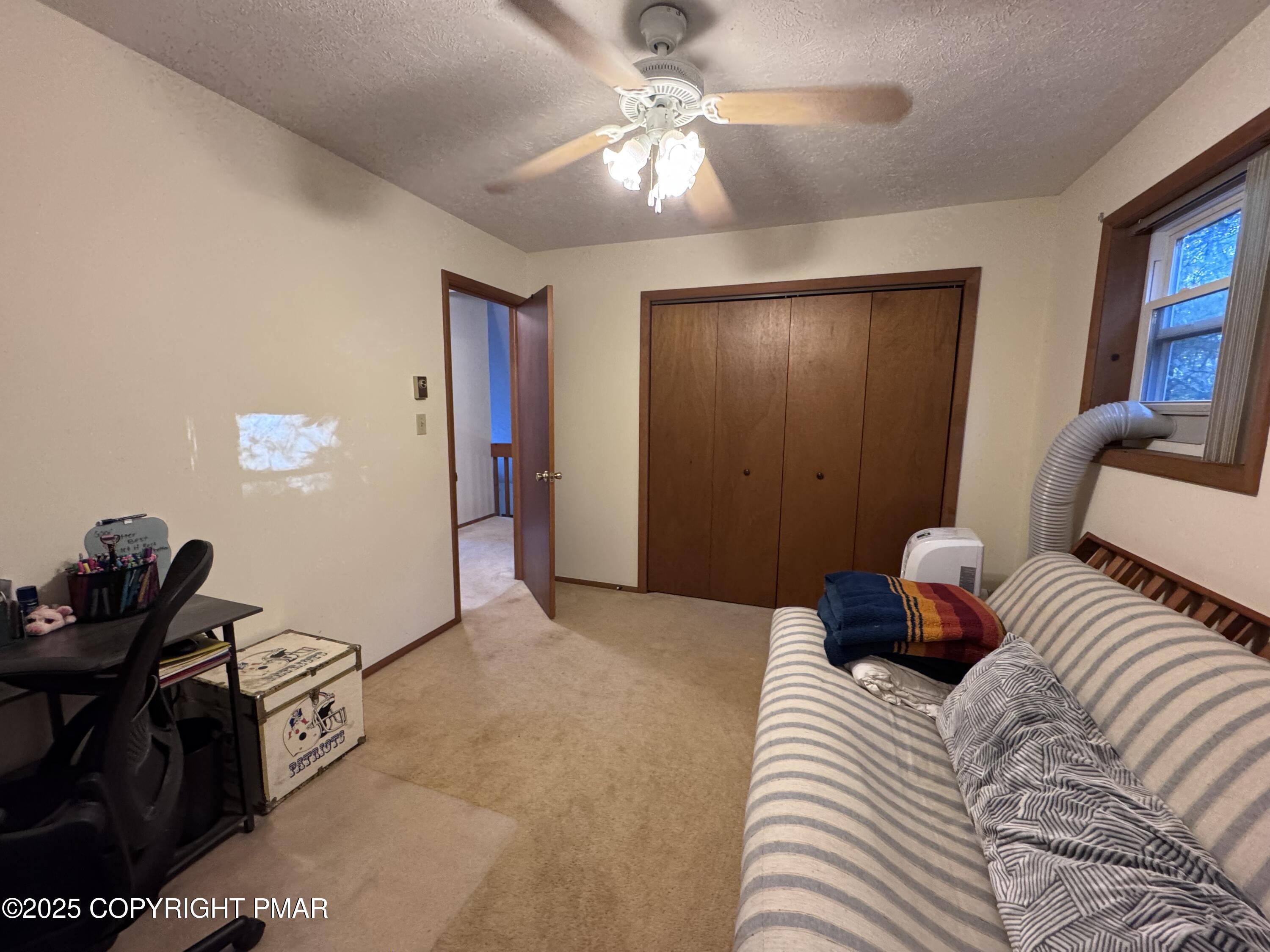 67 Seneca Road Albrightsville, PA 18210 - Photo 30 of 52 a bedroom with a bed and a chandelier