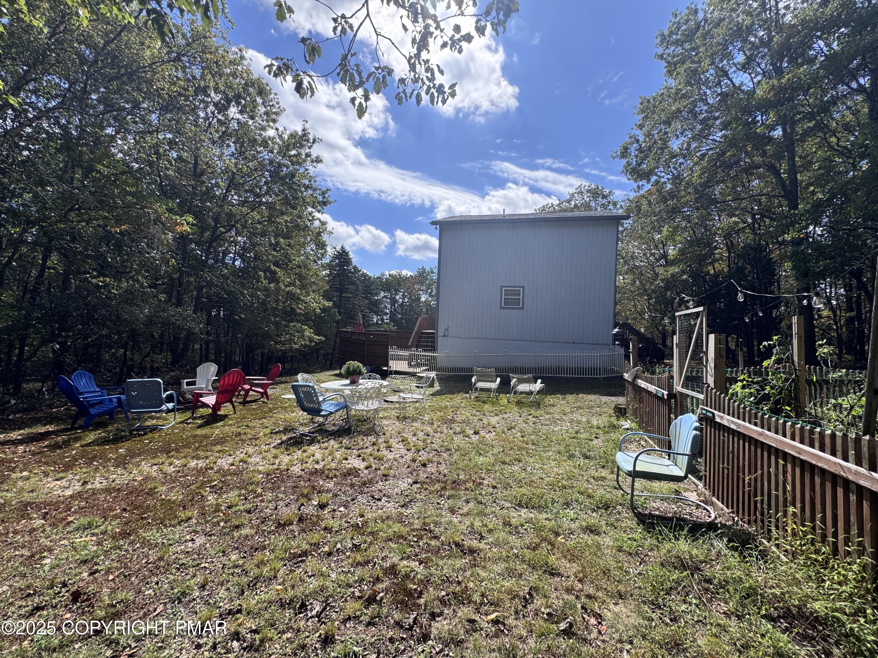 67 Seneca Road Albrightsville, PA 18210 - Photo 42 of 52 a view of a backyard with a bench and wooden fence