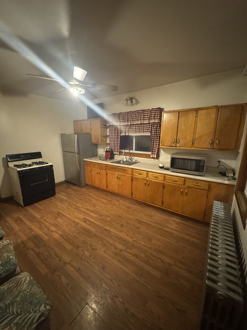 3945 West 55th Place Chicago, IL 60629 - Photo 15 of 21 a room with storage and utility