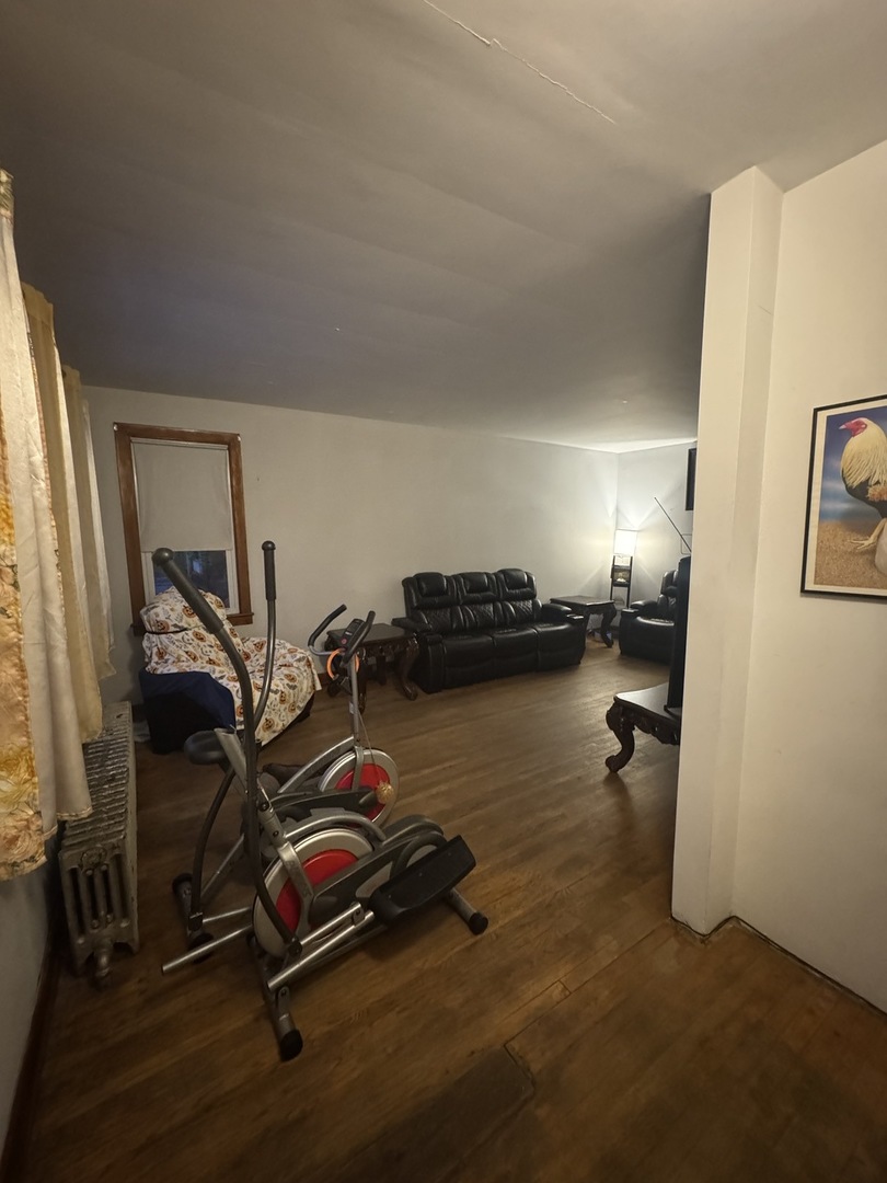 3945 West 55th Place Chicago, IL 60629 - Photo 2 of 21 a room with gym equipment