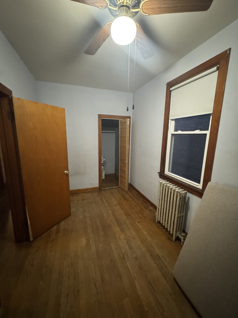 3945 West 55th Place Chicago, IL 60629 - Photo 6 of 21 a view of an empty room with a mirror
