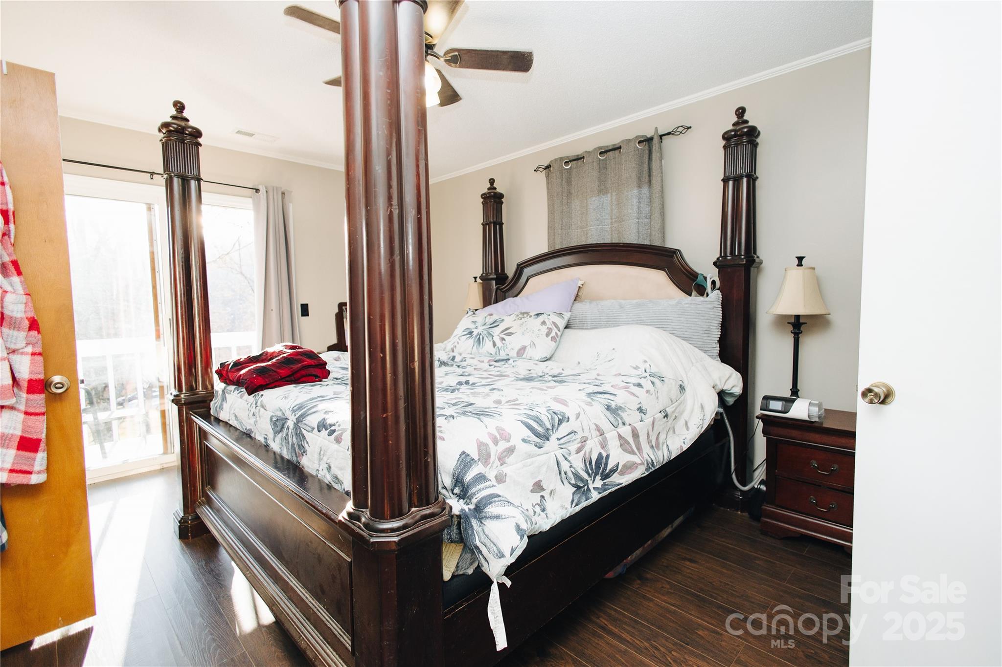 530 Toney Road Marion, NC 28752 - Photo 23 of 48 a bedroom with a bed and wooden floor
