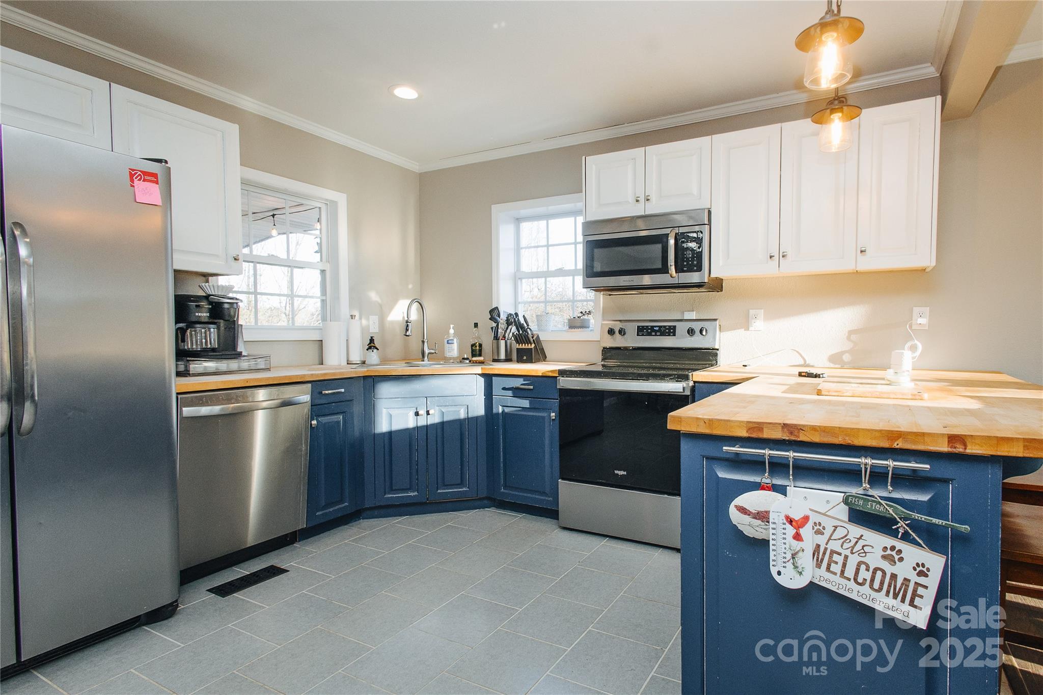 530 Toney Road Marion, NC 28752 - Photo 31 of 48 a kitchen with stainless steel appliances granite countertop a sink stove refrigerator and cabinets