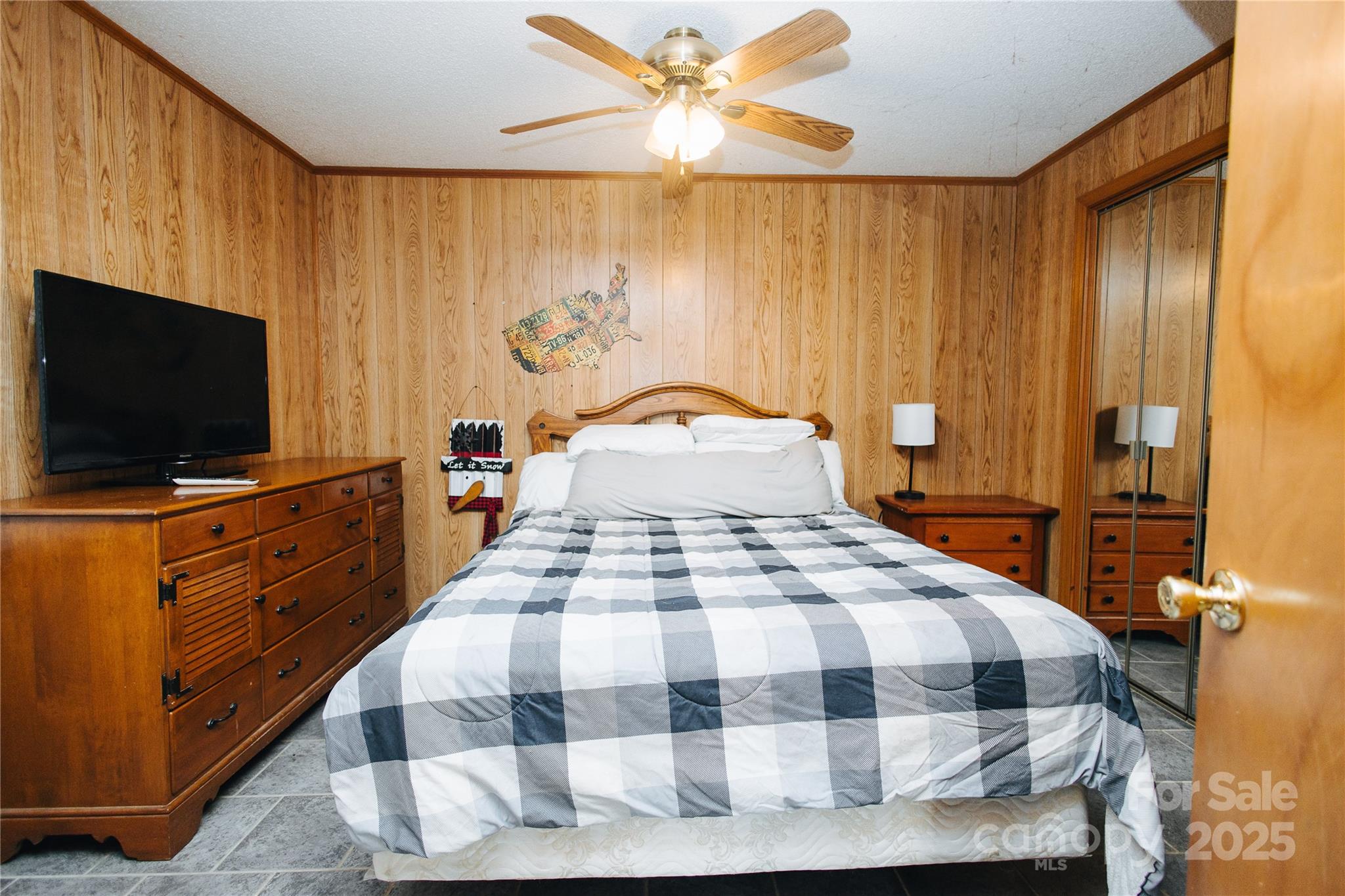 530 Toney Road Marion, NC 28752 - Photo 44 of 48 a bedroom with a bed and a flat tv screen on dresser
