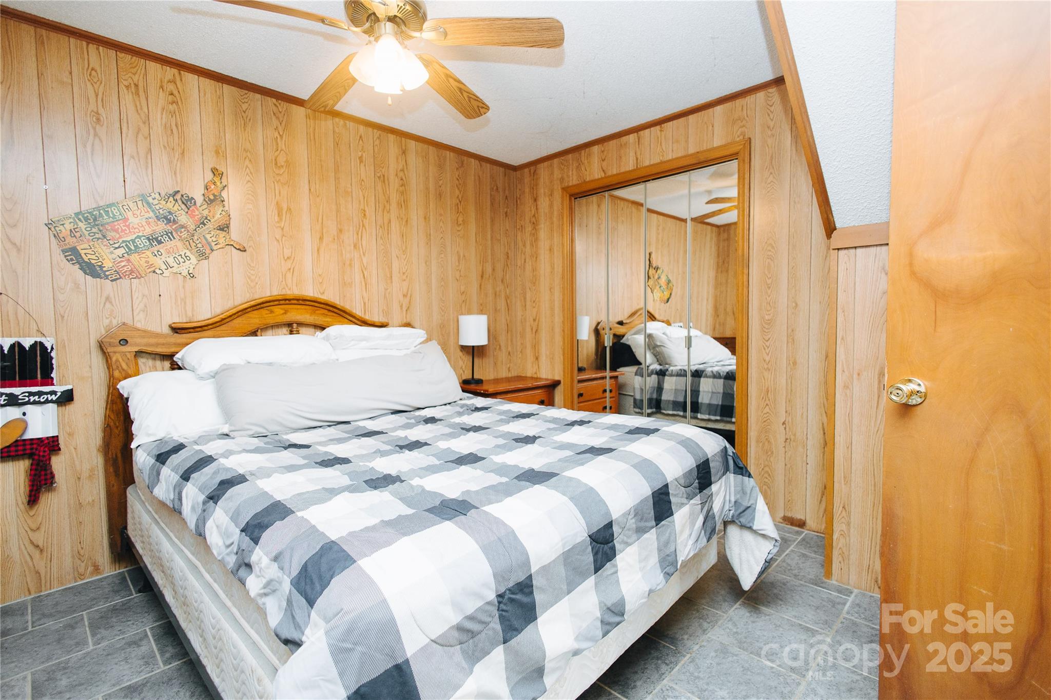 530 Toney Road Marion, NC 28752 - Photo 46 of 48 a bedroom with a bed and a chandelier