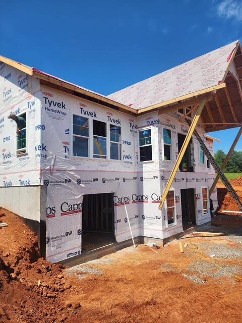 6990 Horseshoe Bend Road Goodview, VA 24095 - Photo 10 of 18 a front view of a house with a yard