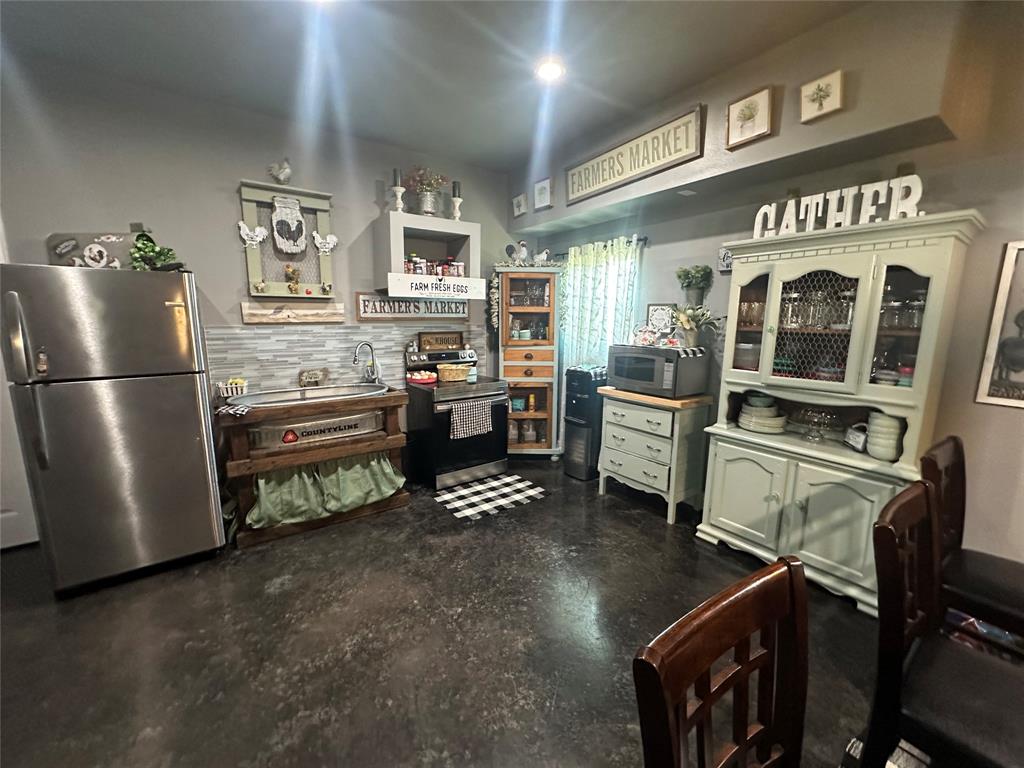 134-1112 1112th Rio Vista, TX 76093 - Photo 1 of 25 a kitchen with stainless steel appliances granite countertop a refrigerator and a stove top oven