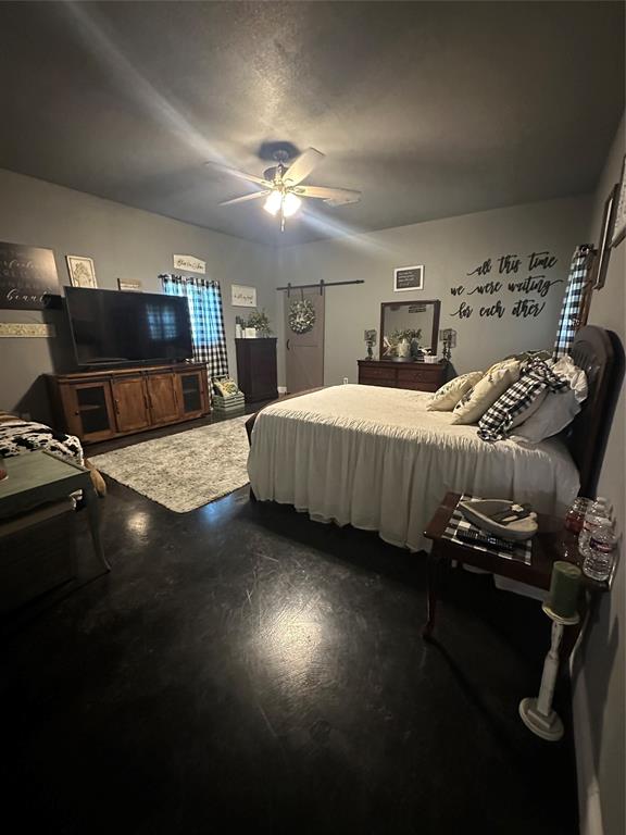 134-1112 1112th Rio Vista, TX 76093 - Photo 13 of 25 a bedroom with a bed gym equipment and view of living room