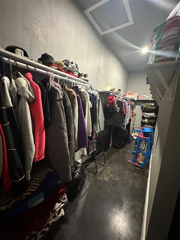 134-1112 1112th Rio Vista, TX 76093 - Photo 14 of 25 a view of walk in closet with clothes and shoes