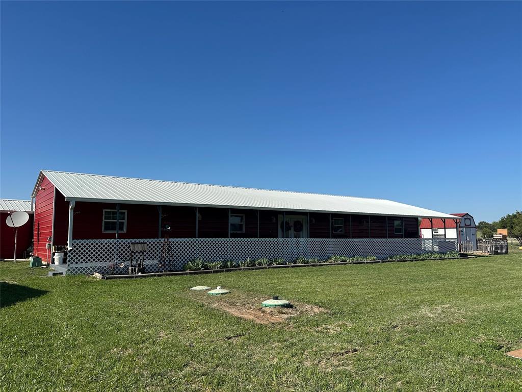 134-1112 1112th Rio Vista, TX 76093 - Photo 16 of 25 a front view of house with yard and outdoor seating