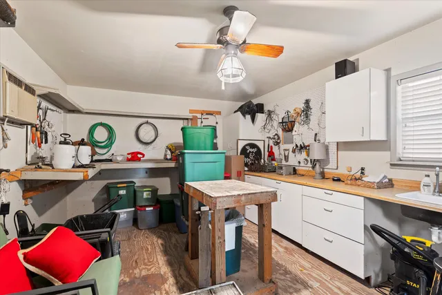 a kitchen filled with stainless steel appliances furniture cabinets and a window
