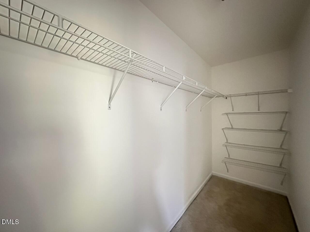 5413 Kissimmee Lane Raleigh, NC 27616 - Photo 15 of 26 a view of a room with racks on the wall