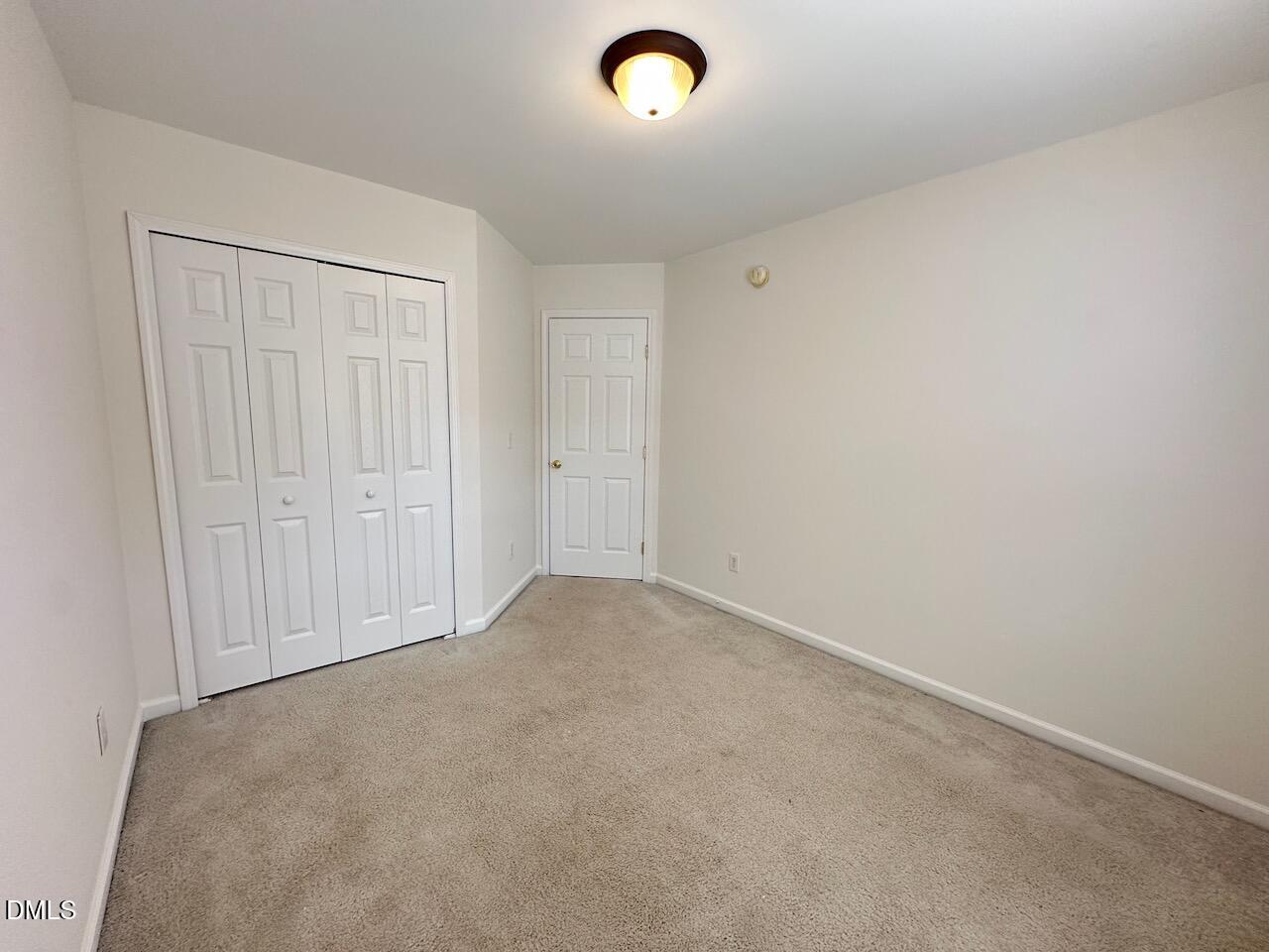 5413 Kissimmee Lane Raleigh, NC 27616 - Photo 20 of 26 an empty room with closet area