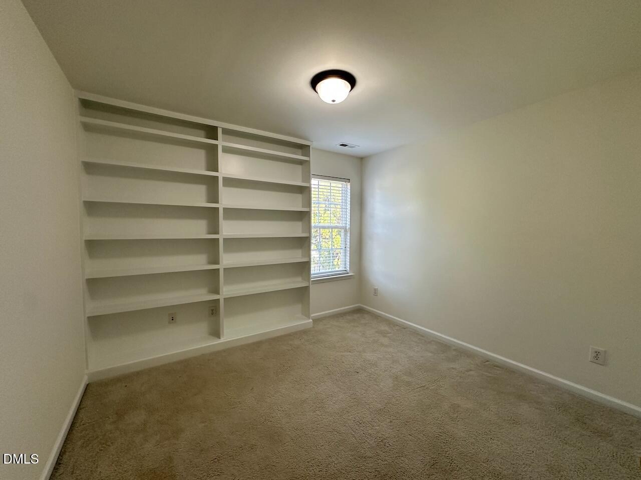 5413 Kissimmee Lane Raleigh, NC 27616 - Photo 22 of 26 a view of an empty room with a window