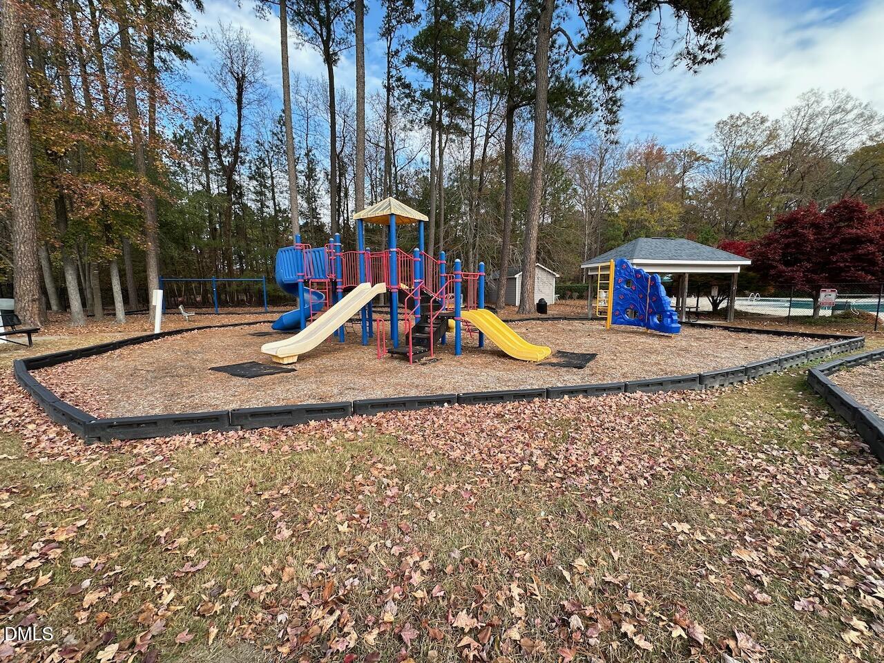 5413 Kissimmee Lane Raleigh, NC 27616 - Photo 26 of 26 a view of outdoor space with swimming pool and slide