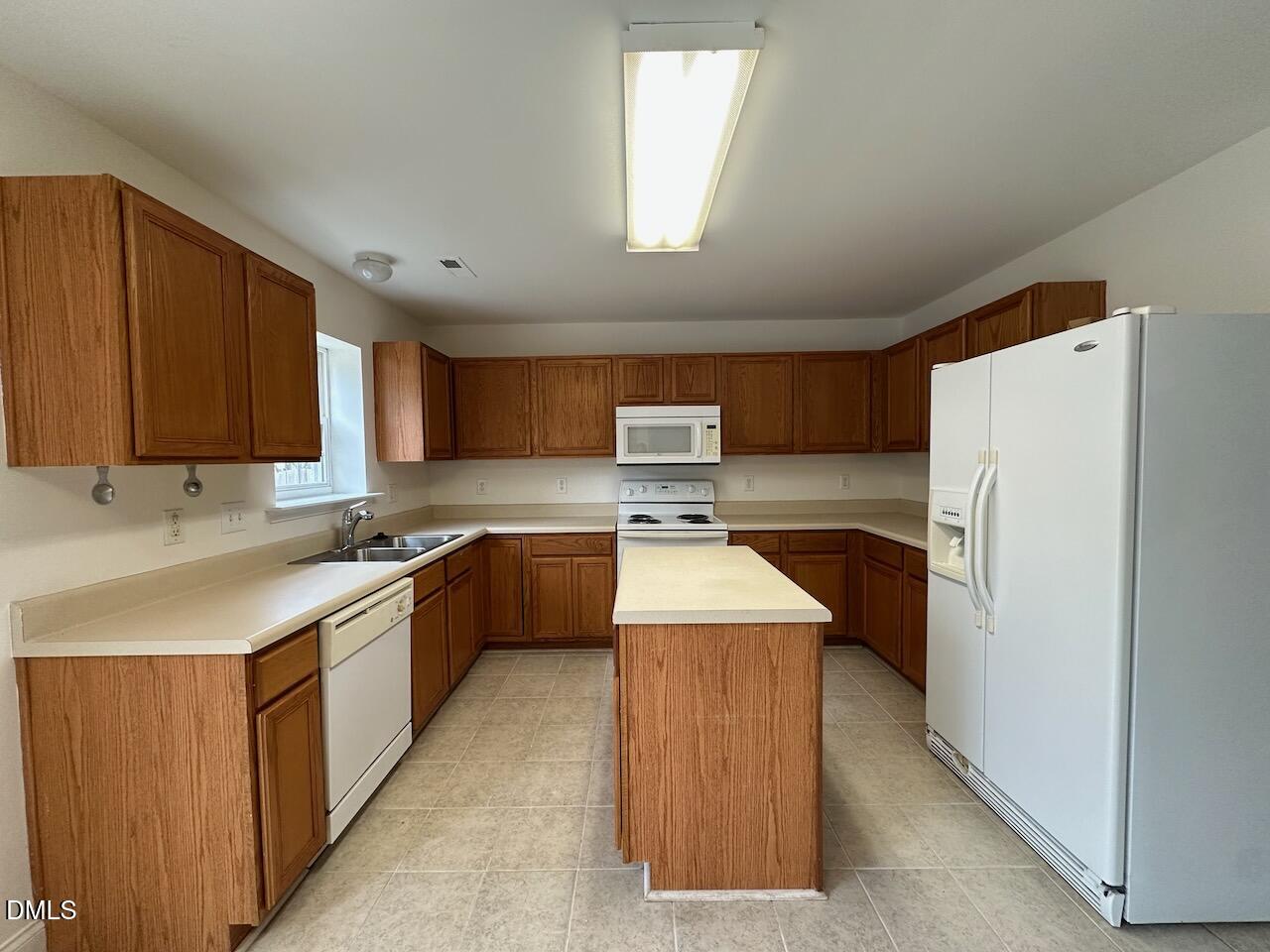 5413 Kissimmee Lane Raleigh, NC 27616 - Photo 10 of 26 a kitchen with stainless steel appliances granite countertop a refrigerator a sink dishwasher a stove and a oven