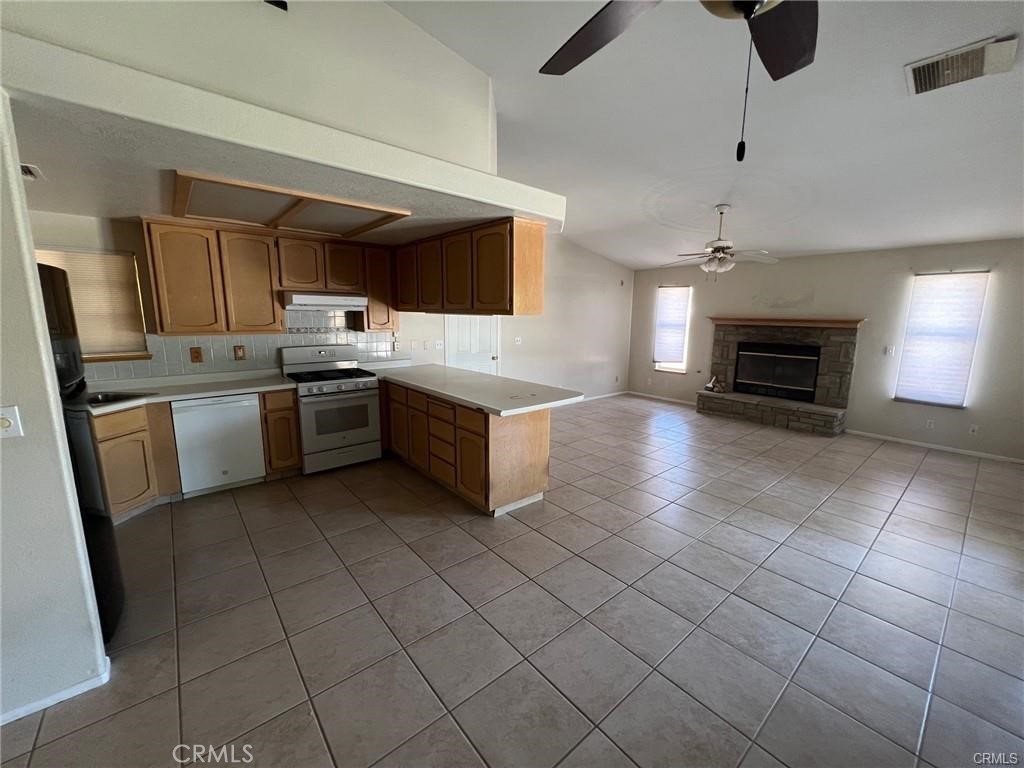 432 Vista Ridgecrest, CA 93555 - Photo 3 of 4 a large kitchen with cabinets and stainless steel appliances